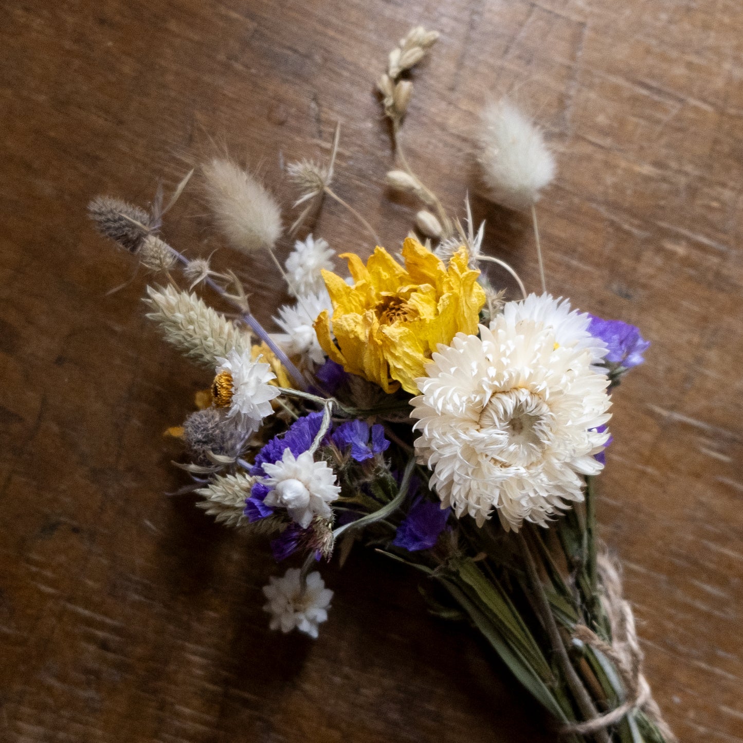 Dried flower blue, white and yellow posy