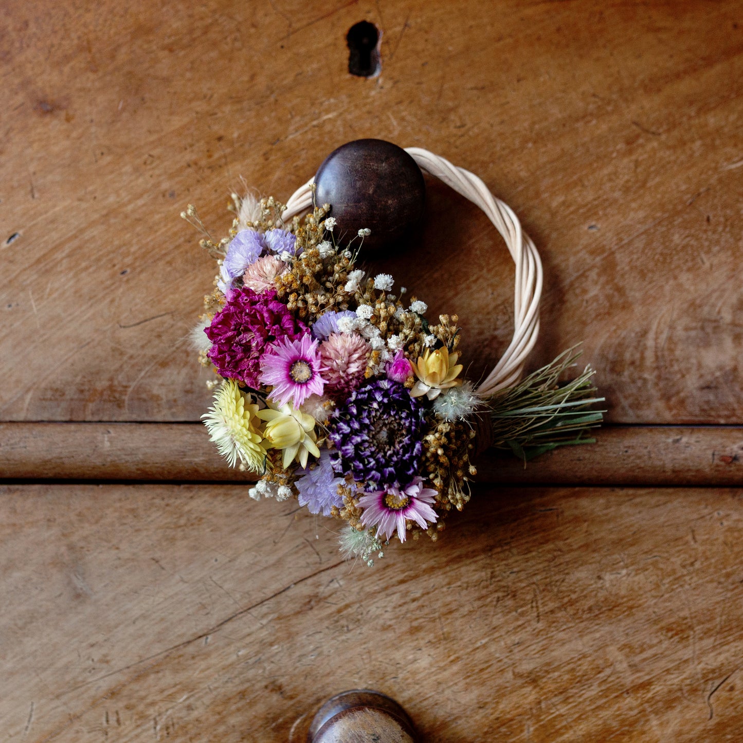 colourful mini dried flower wicker wreath, pink, yellow and lilac, purple