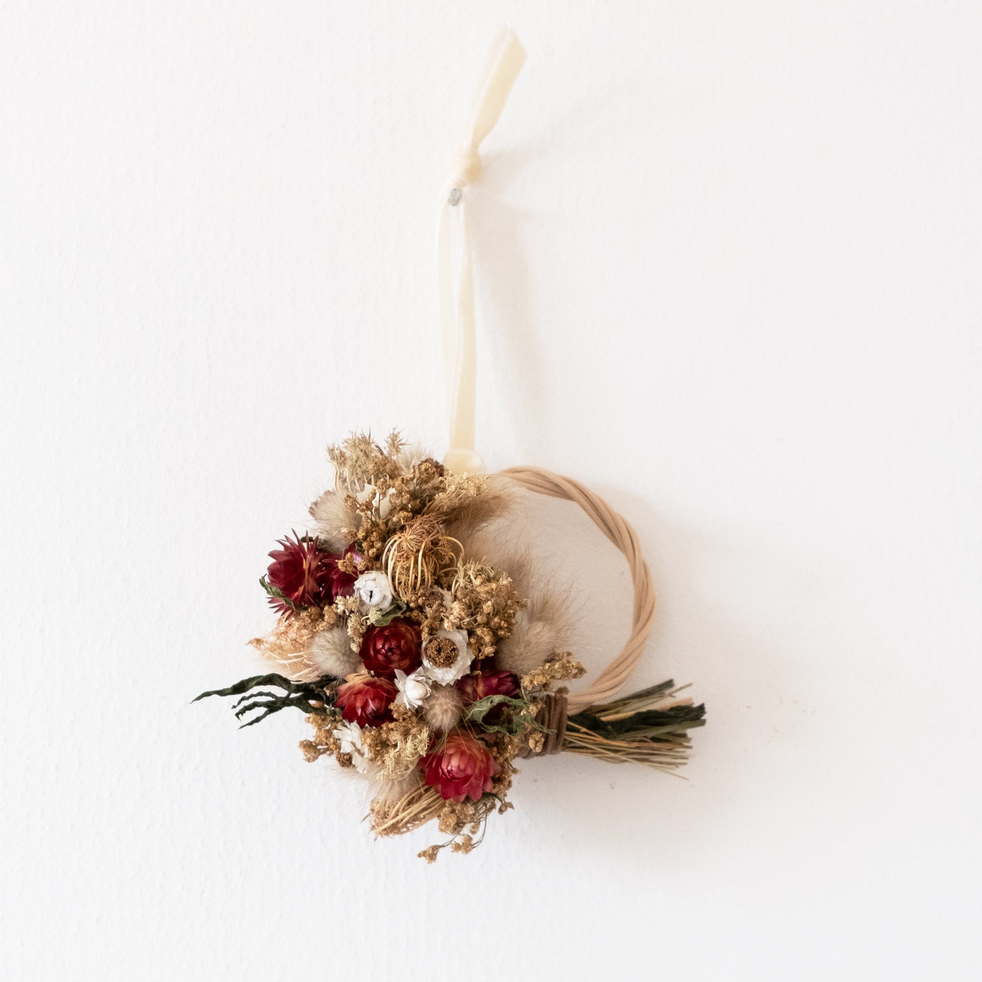 decoration christmas wicker wreath hung on a white wall