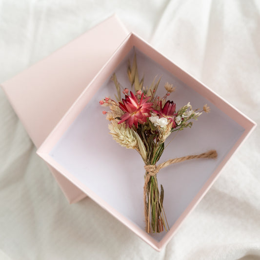 mini strawflower posy in a pale pink gift box with a lid