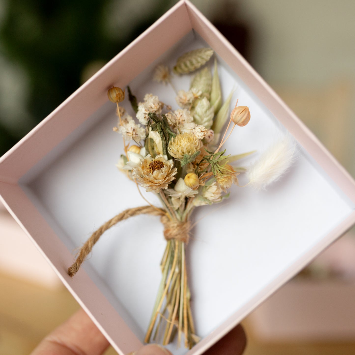 neutral coloured mini posy inside a pale pink gift box