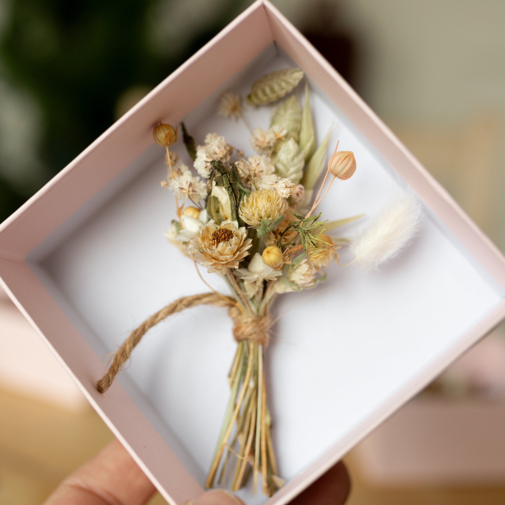 neutral coloured mini posy inside a pale pink gift box